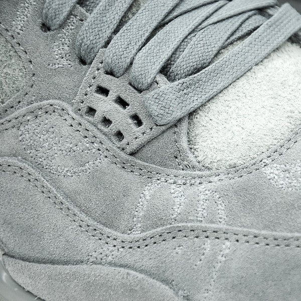 Jordan retro hotsell 4 kaws grey